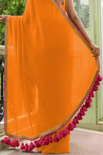 Orange soft cotton solid lace work saree with matching blouse piece