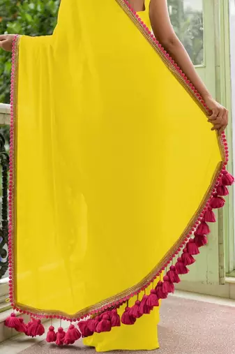 Yellow soft cotton solid lace work saree with matching blouse piece