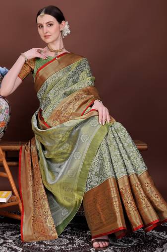 Dark green zari woven silk blend saree