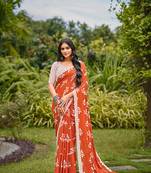 Orange cotton floral print saree with printed blouse piece