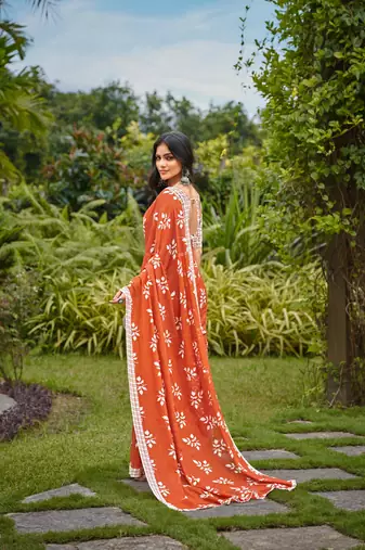 Orange cotton floral print saree with printed blouse piece