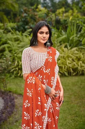 Orange cotton floral print saree with printed blouse piece