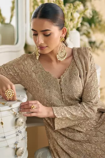 Light pink heavy embroidery dola silk suits