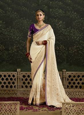 Sequins embroidered border work dola silk blend cream saree 1