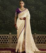 Sequins embroidered border work dola silk cream saree