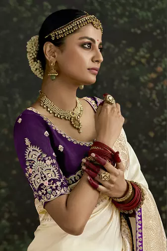 Sequins embroidered border work dola silk blend cream saree