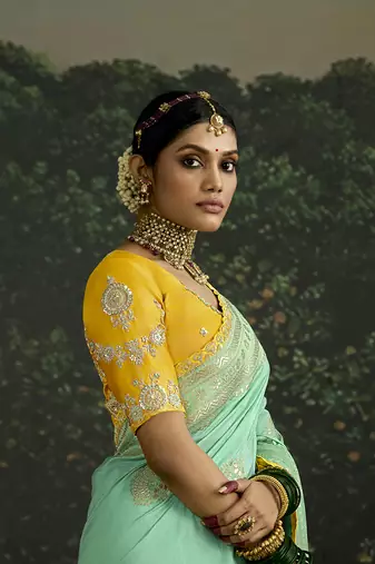 Sequins embroidered border work dola silk blend turquoise saree