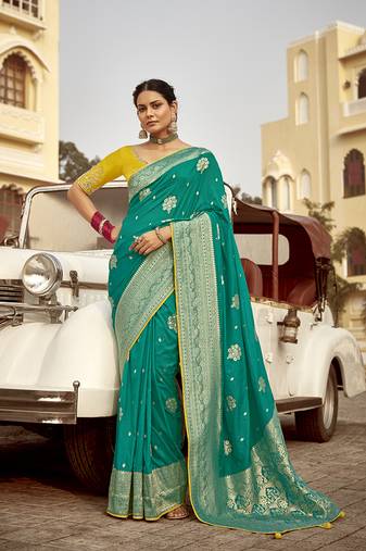 Teal green dola silk saree with heavy zari weaving