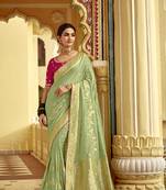 Pista green dola silk saree with golden zari weaving