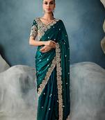 Dark teal tissue embroidered sequins and zari work saree