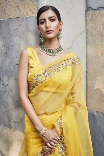 Yellow silk zari woven embroidered saree