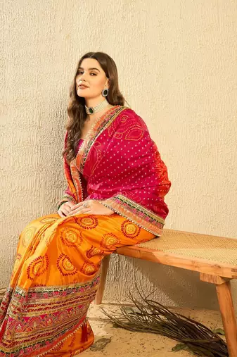 Pink bandhani saree with lace border and unstitched blouse