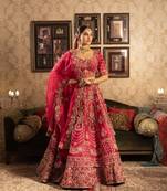 Red silk bridal lehenga with beads and cutdana embellishments