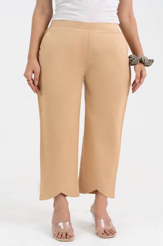 Beige cotton  solid pant with leaf bottom