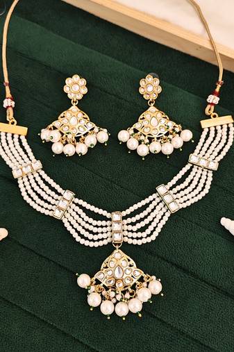 Elegant gold-plated necklace set with intricate design, sparkling stones, and delicate pearls for her , all occasion