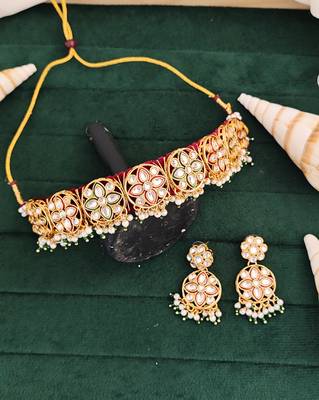 Elegant gold plated kundan choker necklace set with floral motifs, pearls, and matching earrings 1