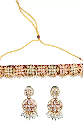 Elegant gold plated kundan choker necklace set with floral motifs, pearls, and matching earrings