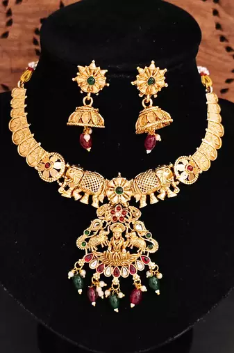 Gold plated elephant motif necklace set with red & green stones and jhumka earrings - elegant indian jewelry.