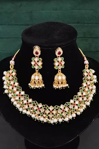Multicolor gold plated jadau kundan necklace set with pearls and navratan style stones - perfect for festive occasions.
