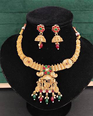 South indian jewelry necklace set with lakshmi pendant, ruby & green stones, coin design, and matching jhumka earrings 3