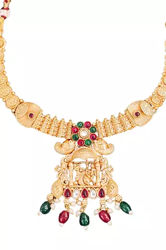 South indian jewelry necklace set with lakshmi pendant, ruby & green stones, coin design, and matching jhumka earrings