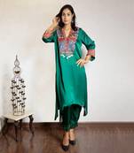 Green asymmetric modal silk kurta set with ajrakh yoke detailing