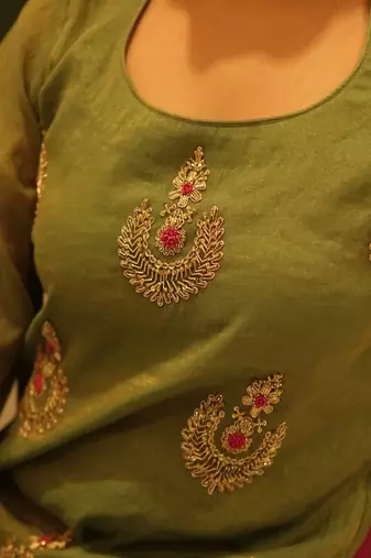 Green hand embroidered tissue sharara set with dupatta
