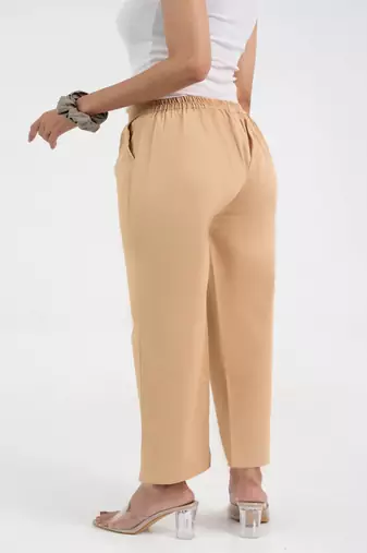 Beige cotton  solid pant with leaf bottom
