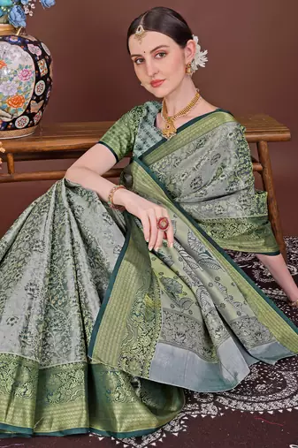 Dark green zari woven silk blend saree