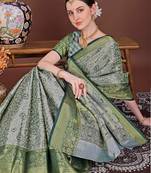 Dark green zari woven silk blend saree