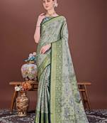 Dark green zari woven silk blend saree