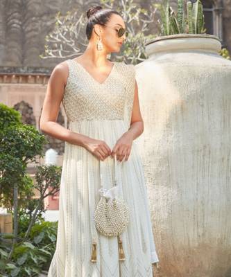 Adara ivory suede potli with pearl gold hanging 4
