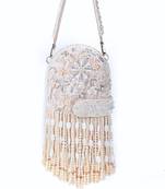 Azmat ivory suede embellished capsule bag