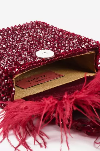 Natali red embellished mini bag with feathers