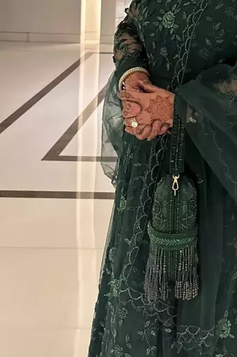 Azmat green suede embellished capsule bag