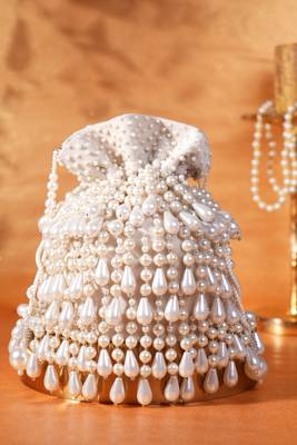 Zarah ivory pearl suede bucket bag 1