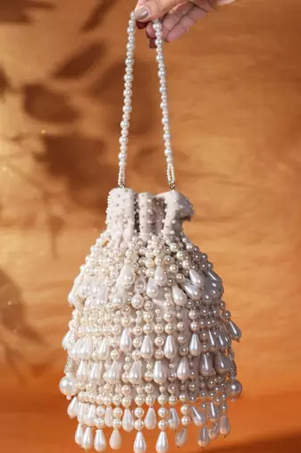 Zarah ivory pearl suede bucket bag