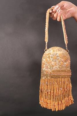 Azmat gold suede embellished capsule bag 1