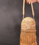 Azmat gold suede embellished capsule bag