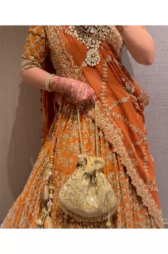 Sunheri gold georgette embellished potli