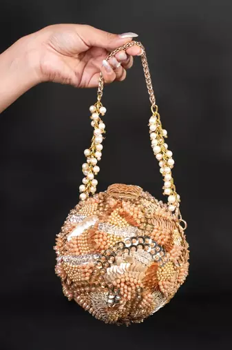 Amna gold suede embellished round bag