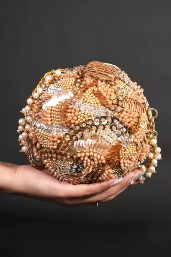 Amna gold suede embellished round bag