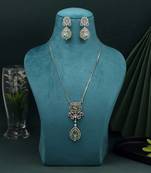 Green color american diamond necklace set with polished finish for festive looks