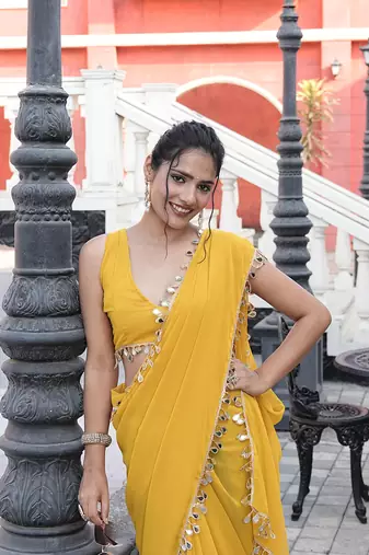 Georgette yellow mirror work embellished sarees