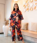 Half buttoned bold floral flared printed cotton top