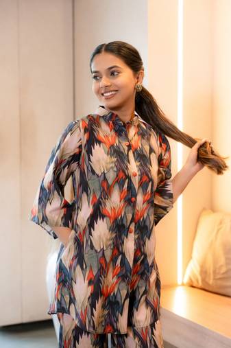 Half buttoned bold flared printed cotton top