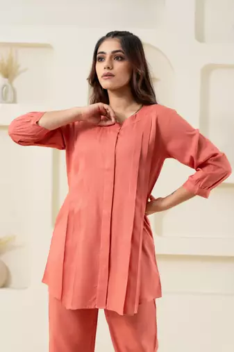 Peach pleated flared solid top