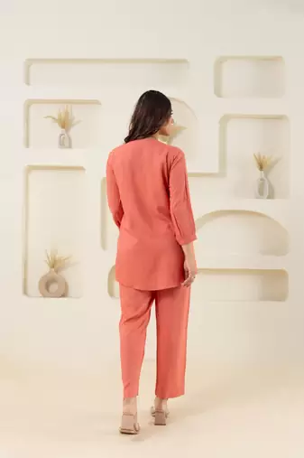 Peach pleated flared solid top