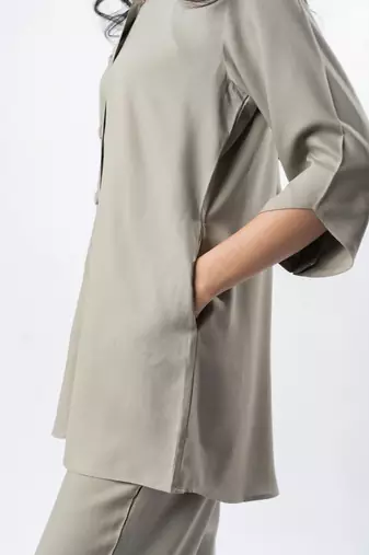Light mocha shawl collar shirt with curved sleeves
