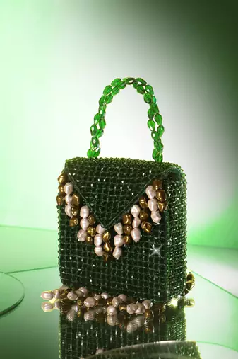 Semi velvet suede based green handbag with crystal bead work